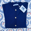 Noyac Knits cobalt blue merino cardigan with vintage Liberty Bell buttons, debuting at the Sag Harbor Arts & Crafts Fair 2026.