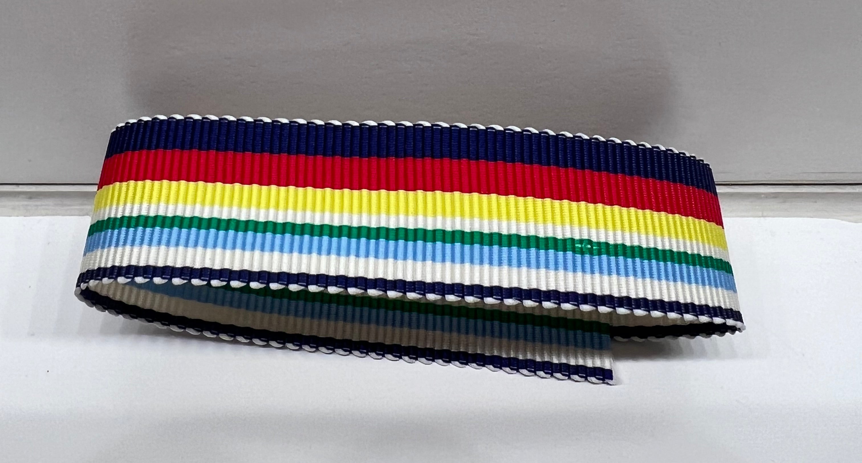 Navy, light blue, yellow, green, red and white striped ribbon on a gray background