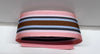 Striped ribbon with pink, blue, black, and brown colors on a white background