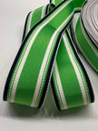 Close up of kelly green, white and navy striped grosgrain ribbon on white background
