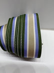 Close up of grostrain ribbon with army green, blue, white and tan stripes