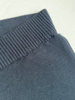 Close-up of waistband of Noyac Knits navy knit ankle pants  made in environmentally sustainable ecoviscose on a white background