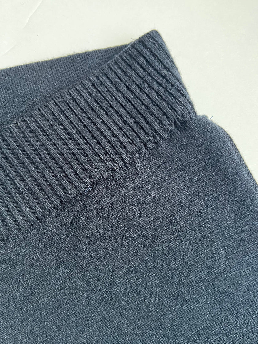 Close-up of waistband of Noyac Knits navy knit ankle pants  made in environmentally sustainable ecoviscose on a white background
