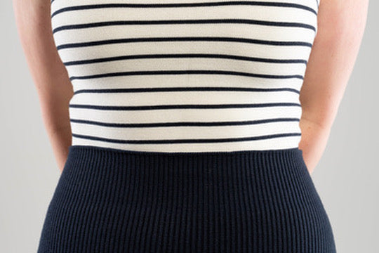 close up of waist line of Noyac Knits navy ribbed knit midi skirt in stretch, environmentally sustainable ecoviscose