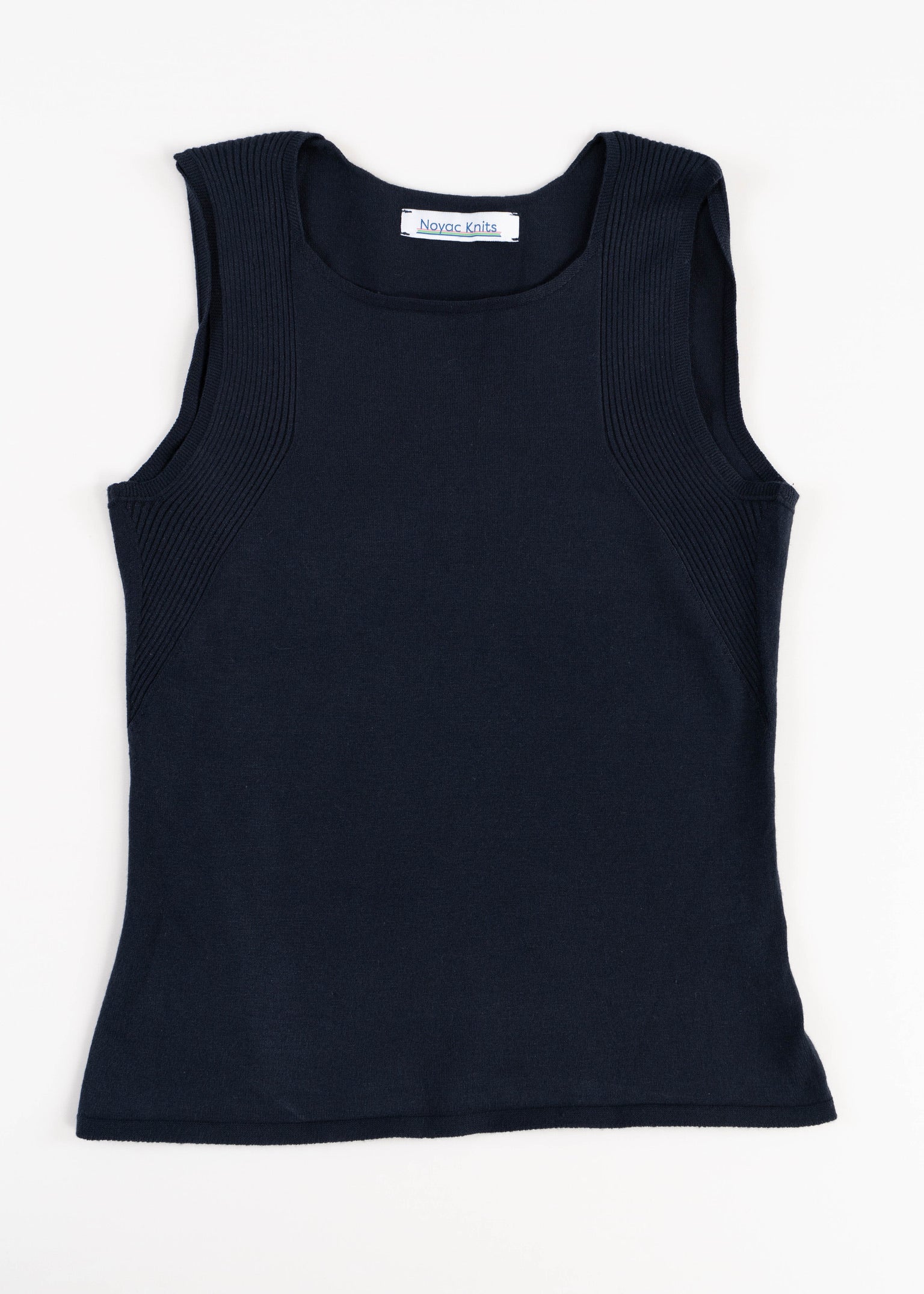 
Flat lay photo of Noyac Knits navy scoop neck sleeveless top in lightweight and environmentally sustainable ecoviscose on a white background