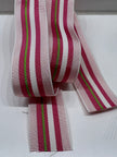 Close up of grosgrain ribbon with light pink, dark pink, white, and lime green stripes on plain background.