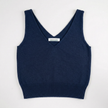 Lay flat photo of Noyac Knits navy blue double v-neck crop tank made in lightweight, soft cotton on white background