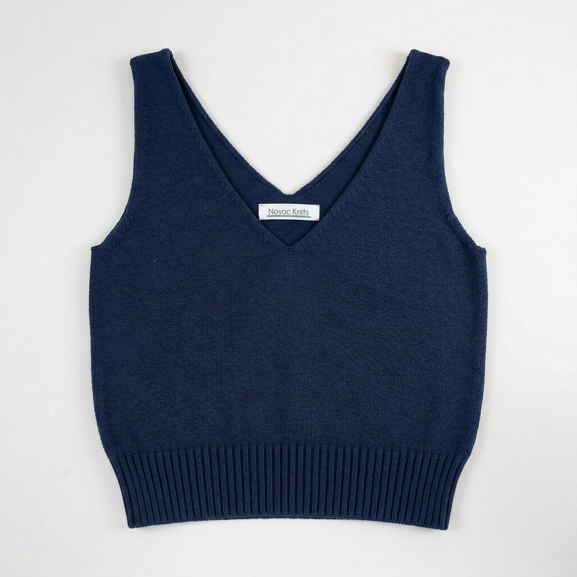 Lay flat photo of Noyac Knits navy blue double v-neck crop tank made in lightweight, soft cotton on white background
